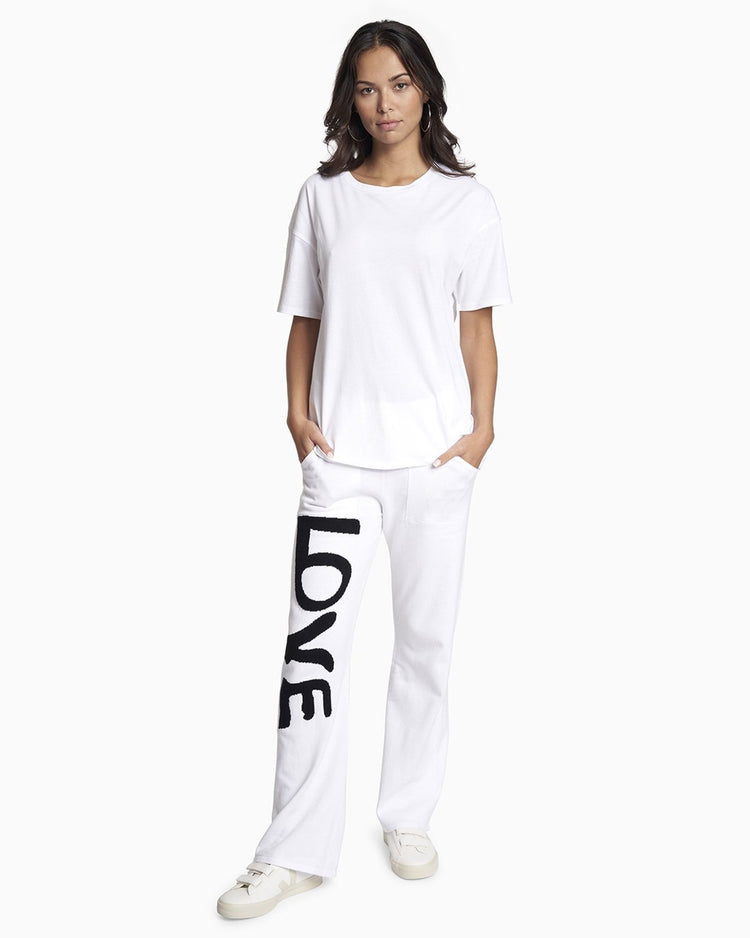 YesAnd Organic Knit Pant Knit Pant in color Black Love on White and shape pants